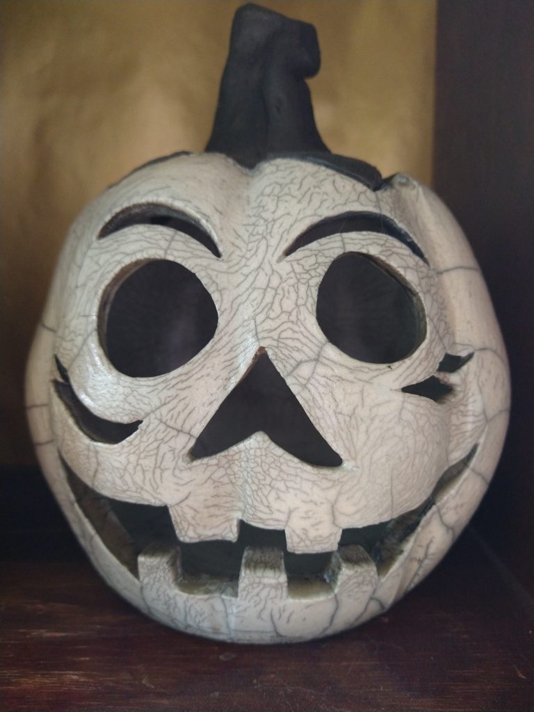 Ceramic Jack-o-Lantern in black and crackly white.