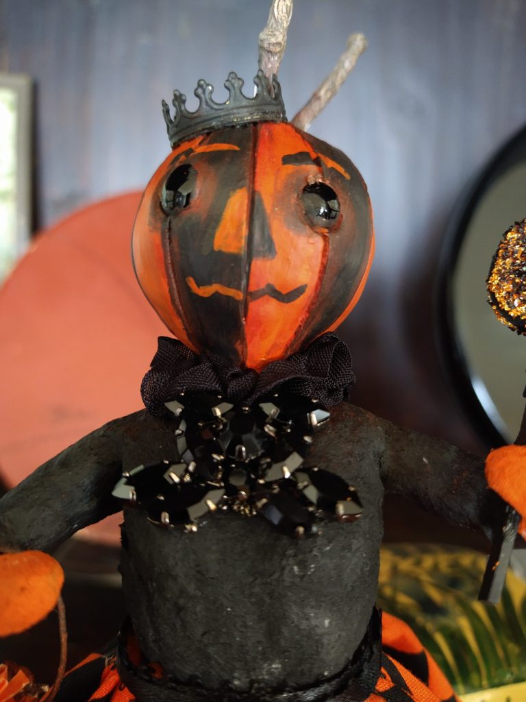 Pumpkin Queen doll with assembled and sculpted pieces, with a folk art vibe.