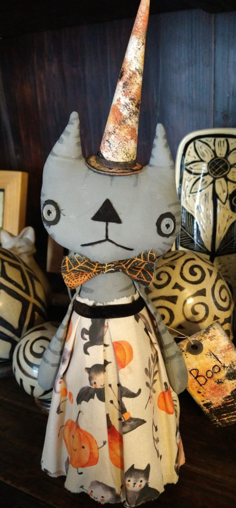 Gray fabric Halloween kitty with colorful dress.