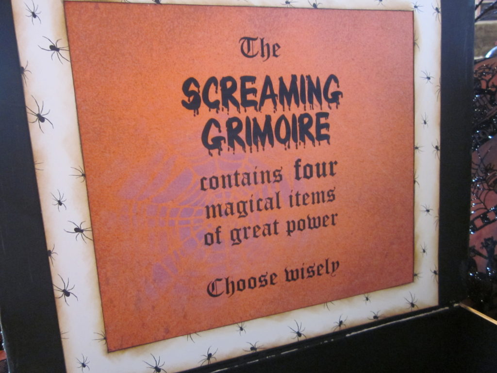 Screaming Grimoire contains FOUR magical items of great power. Choose wisely.