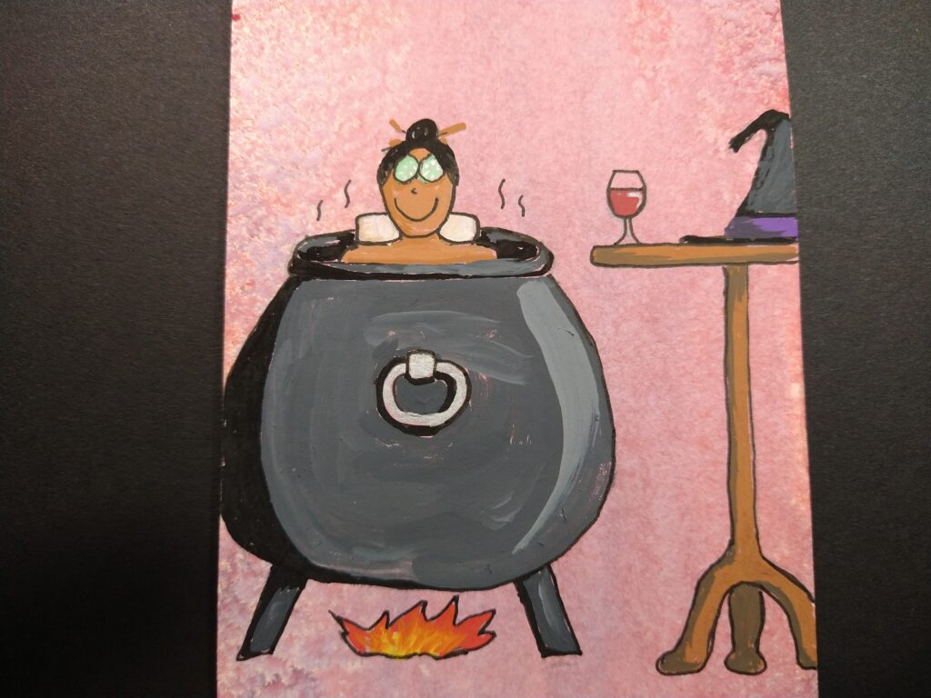 Drawing of a witch enjoying a soak in her cauldron. She has cucumber slices on her eyes, and beside her is a glass of wine and her hat.